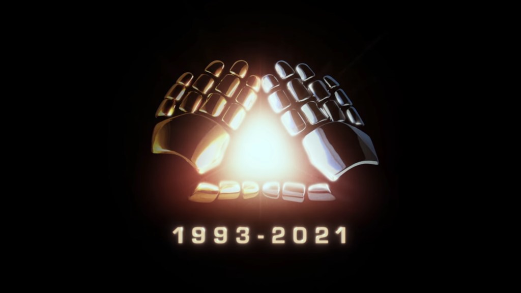 A pair of gloves with a gold chrome finish on the left and a silver chrome finish on the right forming a glowing triangle with their index fingers and thumbs. The years 1993 to 2021 is placed underneath.